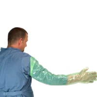 Man showing size of arm length gloves